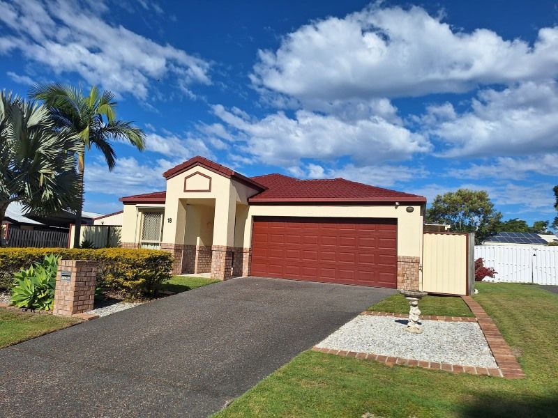 A House With a Red Garage Door and a Palm Tree in the Background — Roofing Gold Coast in Tallebudgera, QLD