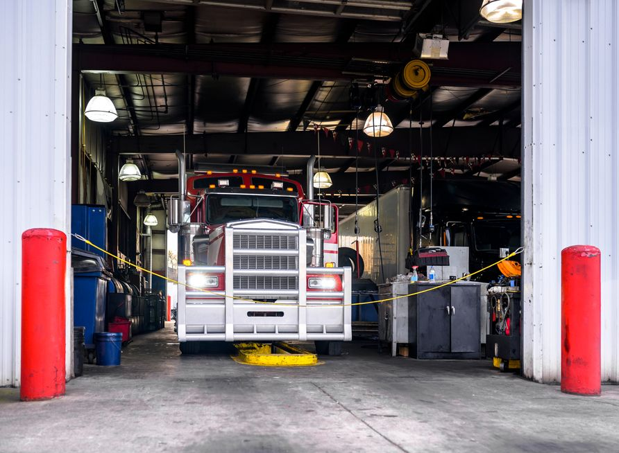 Semi-truck Inside a Garage With Red Support Beams — COD Automotive in  Ashmont, NSW
