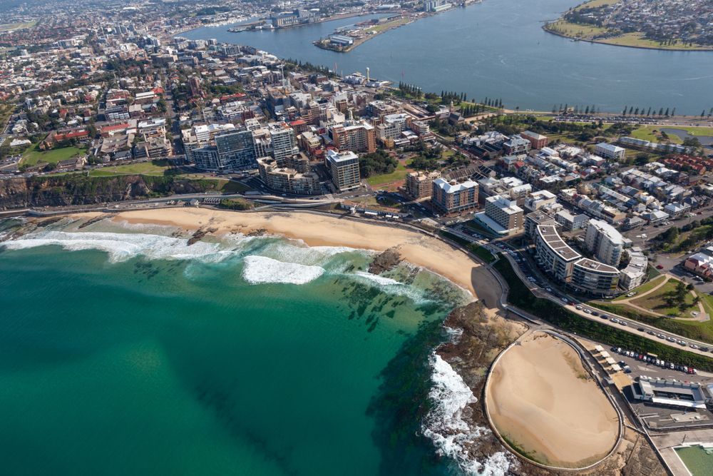 An Aerial View of a City Surrounded by Water and a Beach — South Coast Radiators In Newcastle, NSW