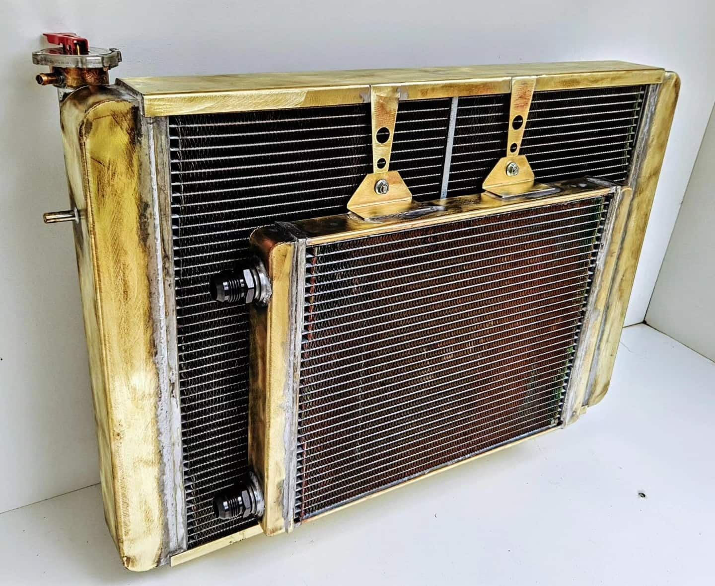 A Brass Radiator is Sitting on a White Surface — South Coast Radiators In Woonona, NSW