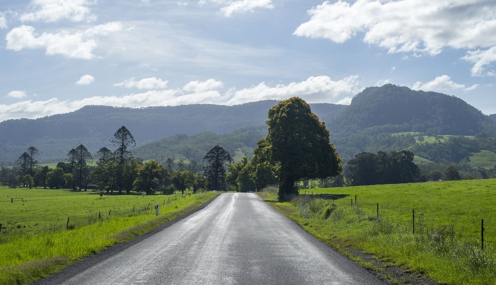 A Road Going Through a Grassy Field — South Coast Radiators In Southern Highlands, NSW