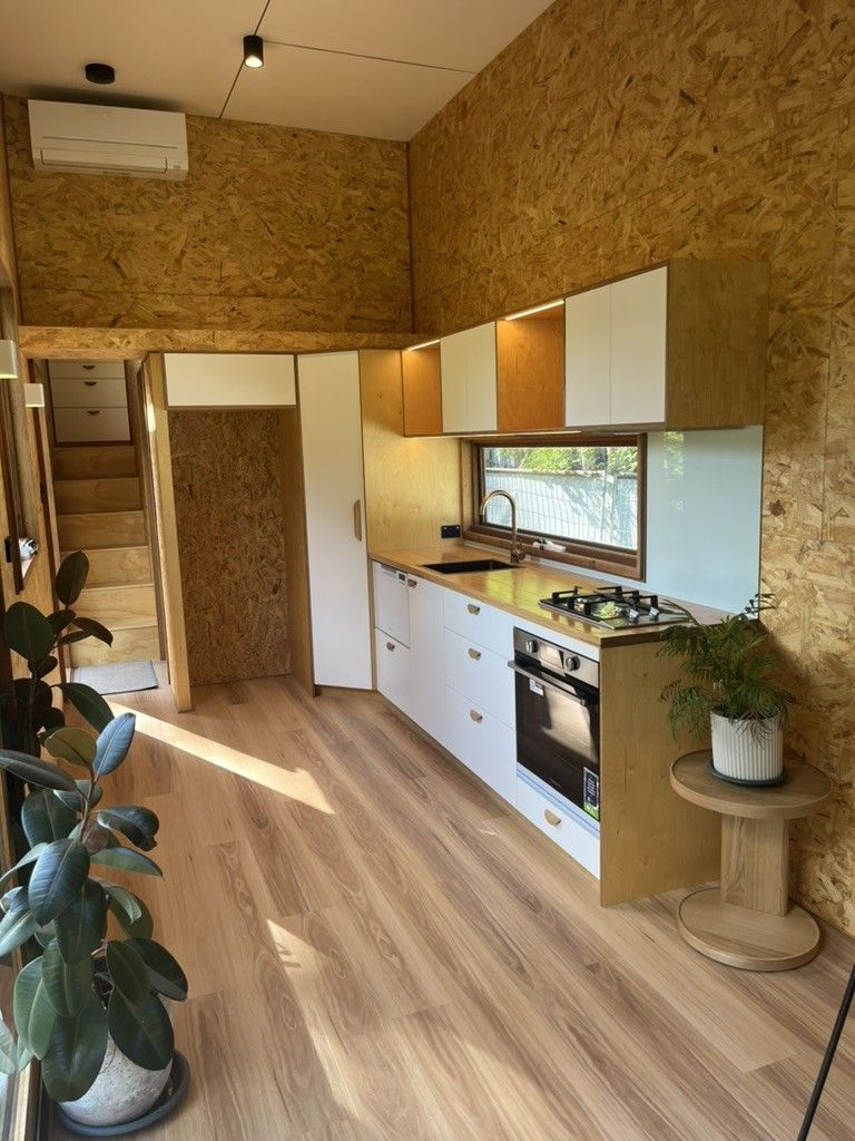 A Kitchen With Wooden Cabinets, a Stove, and a Window — D Hinged Kitchens & Joinery in Main Arm, NSW