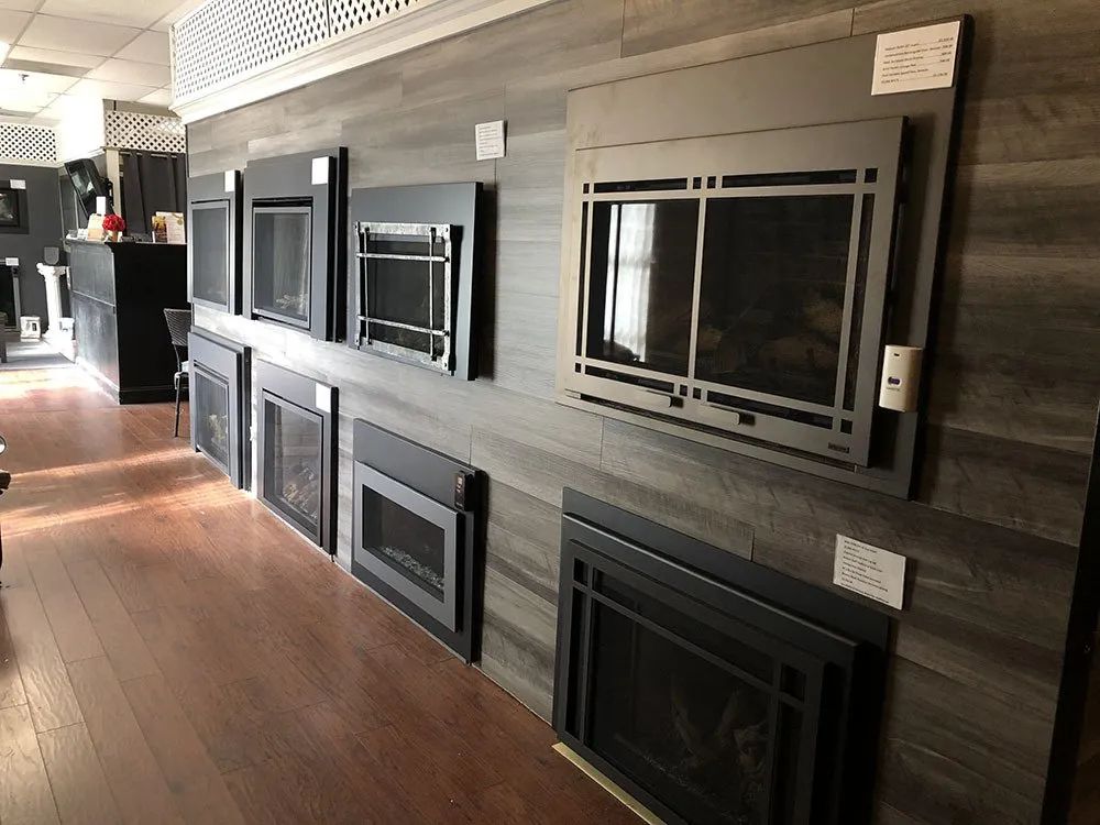 A room with a lot of fireplace surrounds on the wall.