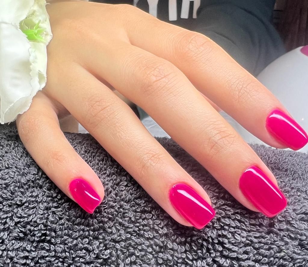 UV gel nail extensions in vibrant pink finish at Perfect You Spa