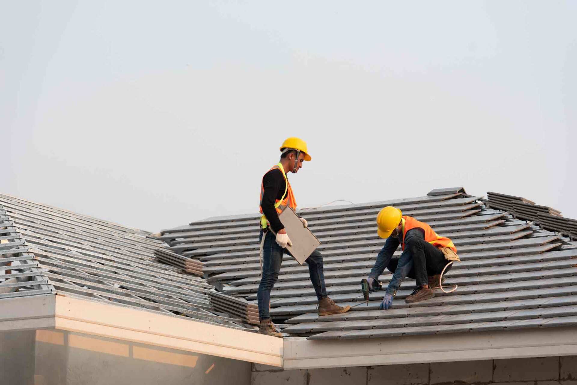 Two Workers Fixing Roof — Lakeville, MN — Bradach Roofing Siding & Window Two Workers Fixing Roof — Lakeville, MN — Bradach Roofing Siding & Window