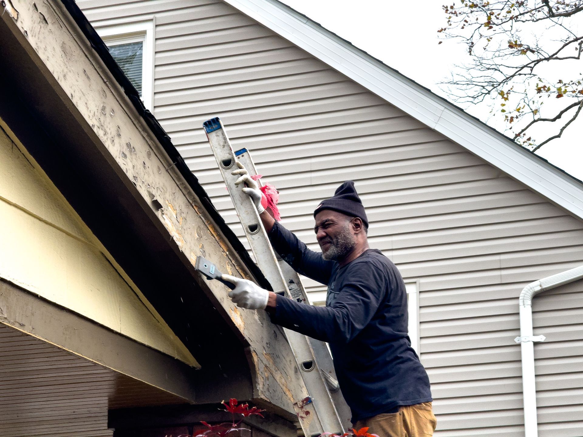 Exterior Painting: Scraping old exterior painting in Cleveland, Ohio
