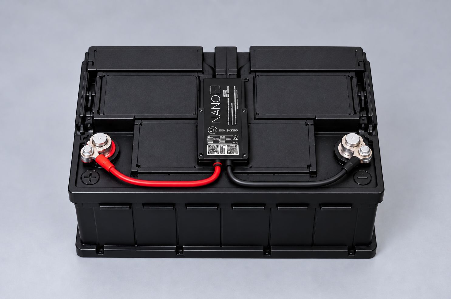 AGL Nano tracker connected to a vehicle battery with red positive and black negative cables securely fitted.