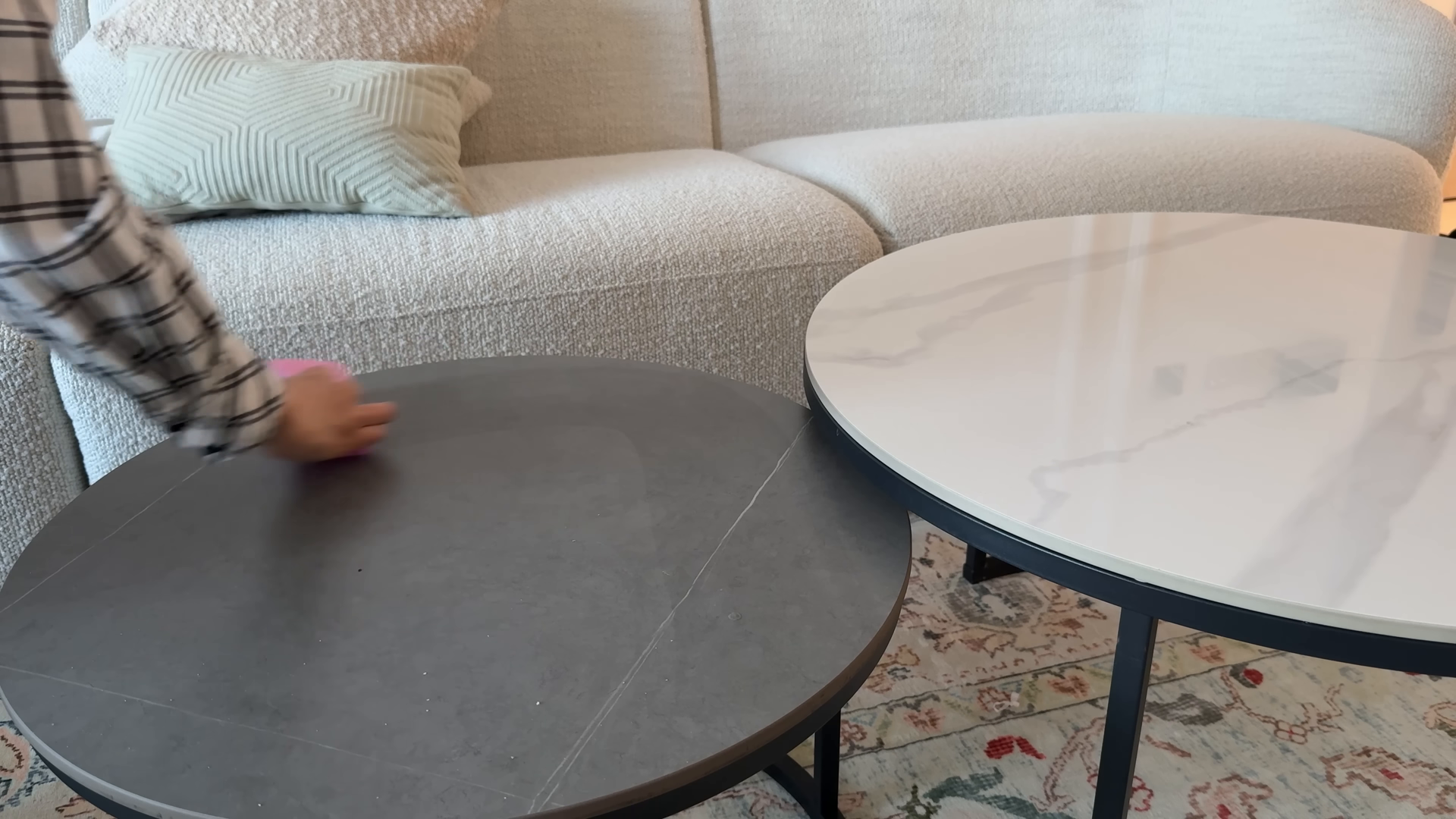 Maid service tidying an East Village living room