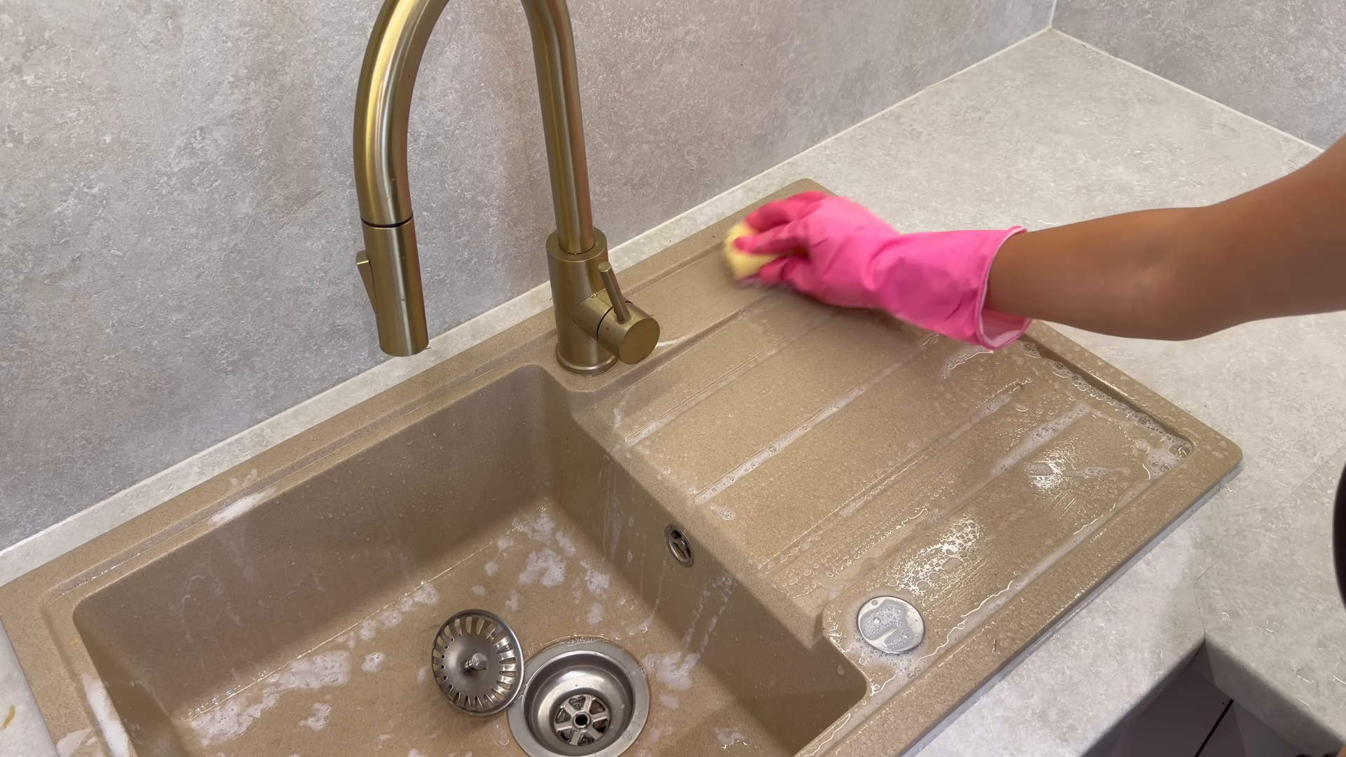 Lily Maids cleaner deep cleaning a bright Fort George Manhattan apartment