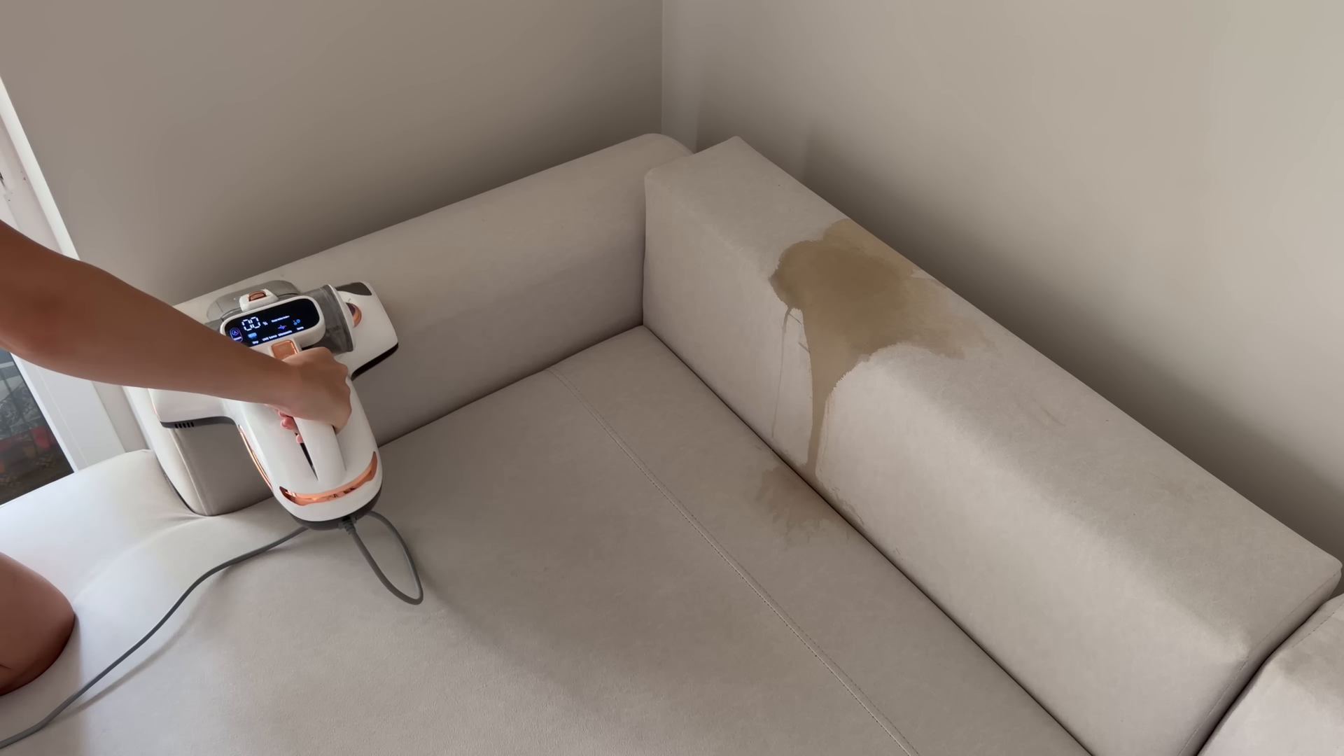 Cleaner wiping down a bright Manhattan living room the morning after a next-day booking