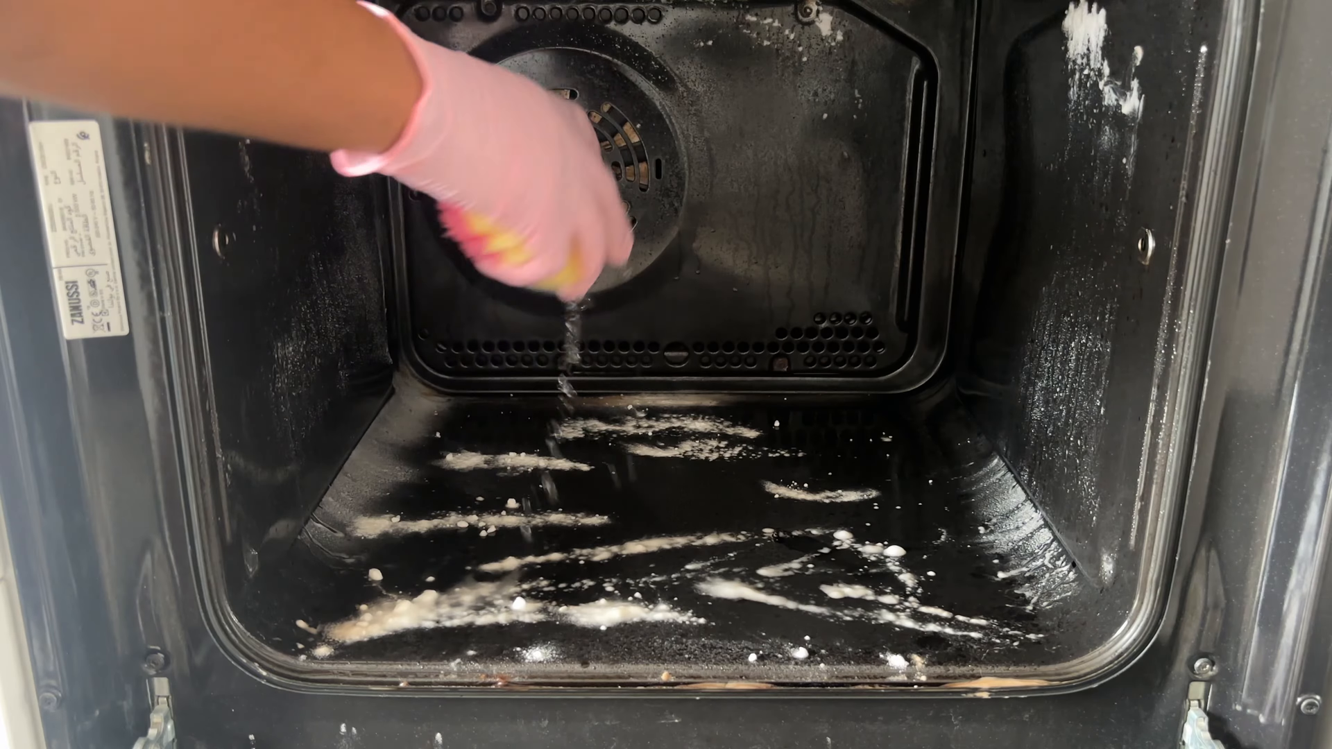 Housekeeper wiping down a loft kitchen near Hudson Square in Manhattan