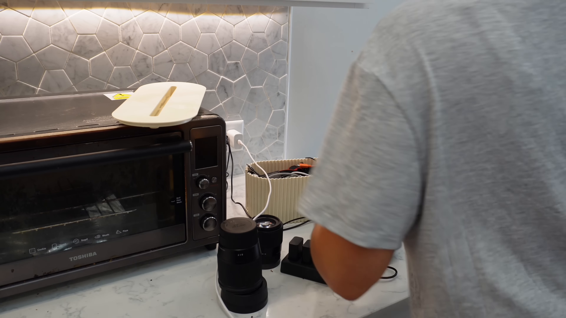 Housekeeper wiping down surfaces during a post-repair cleanup in a downtown Manhattan apartment