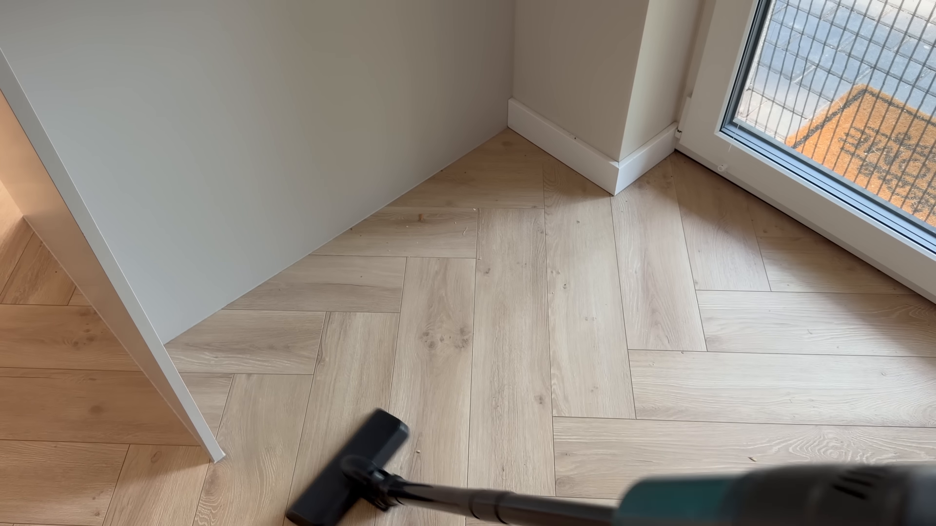 Cleaning service working the floors of a Midtown Manhattan apartment