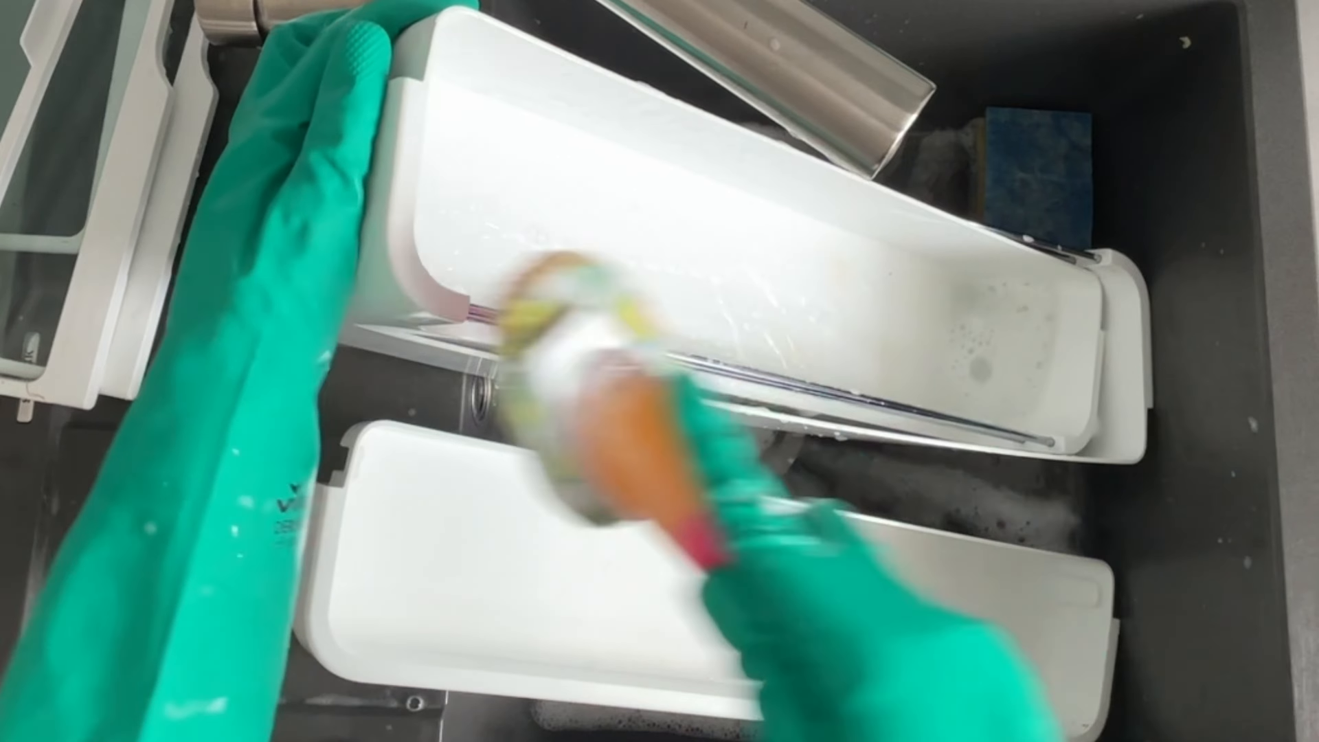 Housekeeper wiping counters during a standard cleaning in a Midtown Manhattan apartment