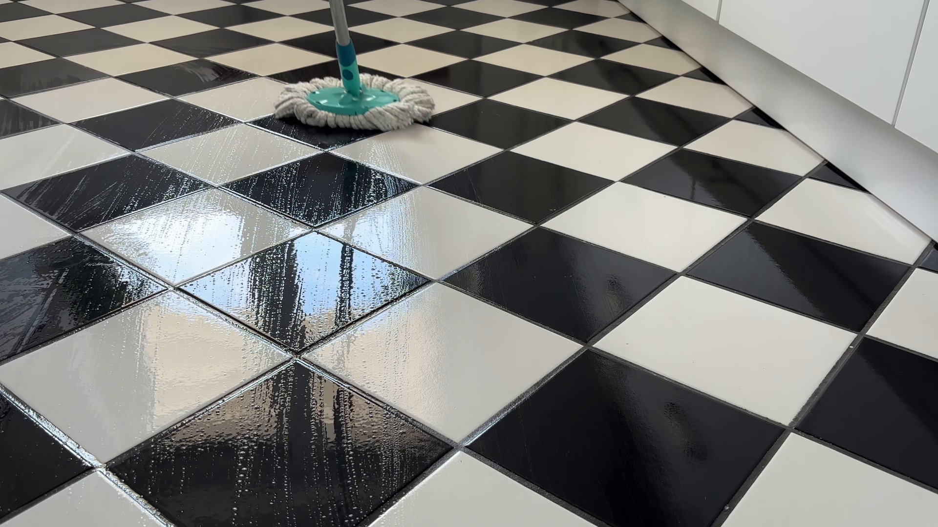 Housekeeper detailing a Midtown Manhattan kitchen before an open house