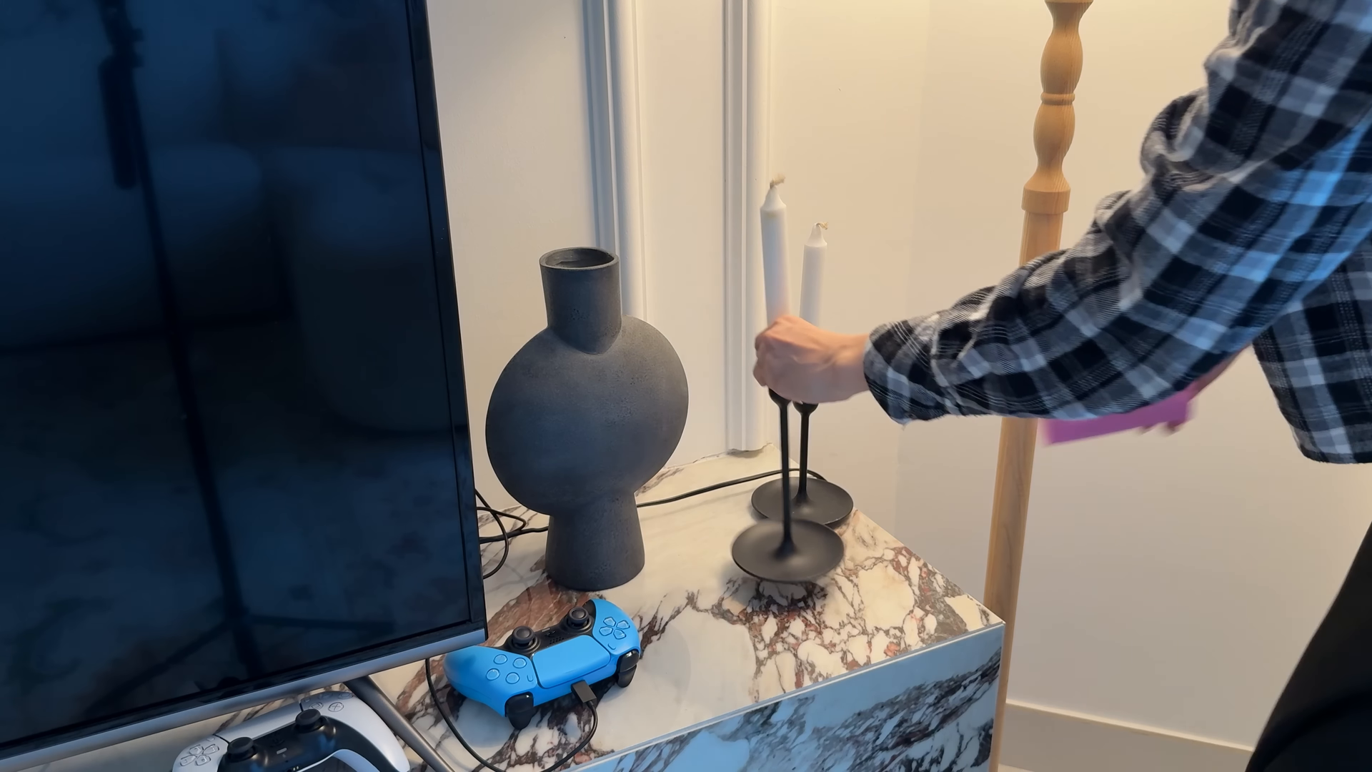 Housekeeper tidying a Midtown West Manhattan bedroom