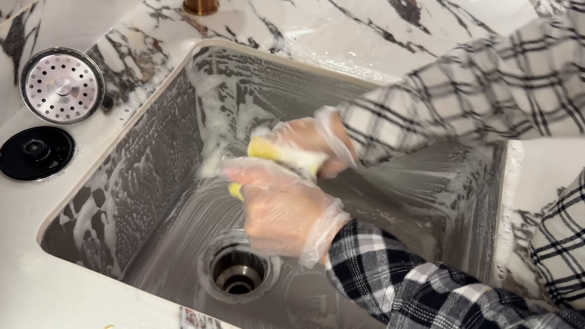 Cleaner dusting shelves in a Nolita apartment