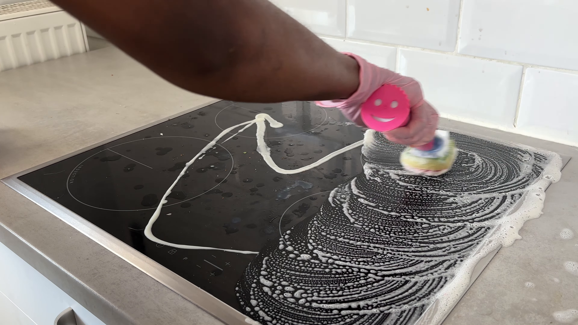 Housekeeping service finishing a kitchen in a NoMad Manhattan apartment