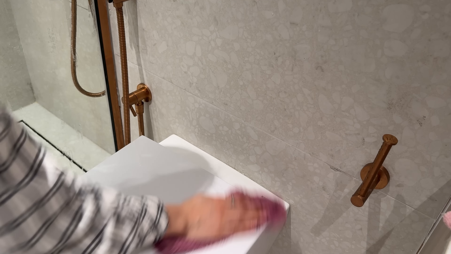Cleaner finishing a short-term rental turnover in a North Corona Queens home