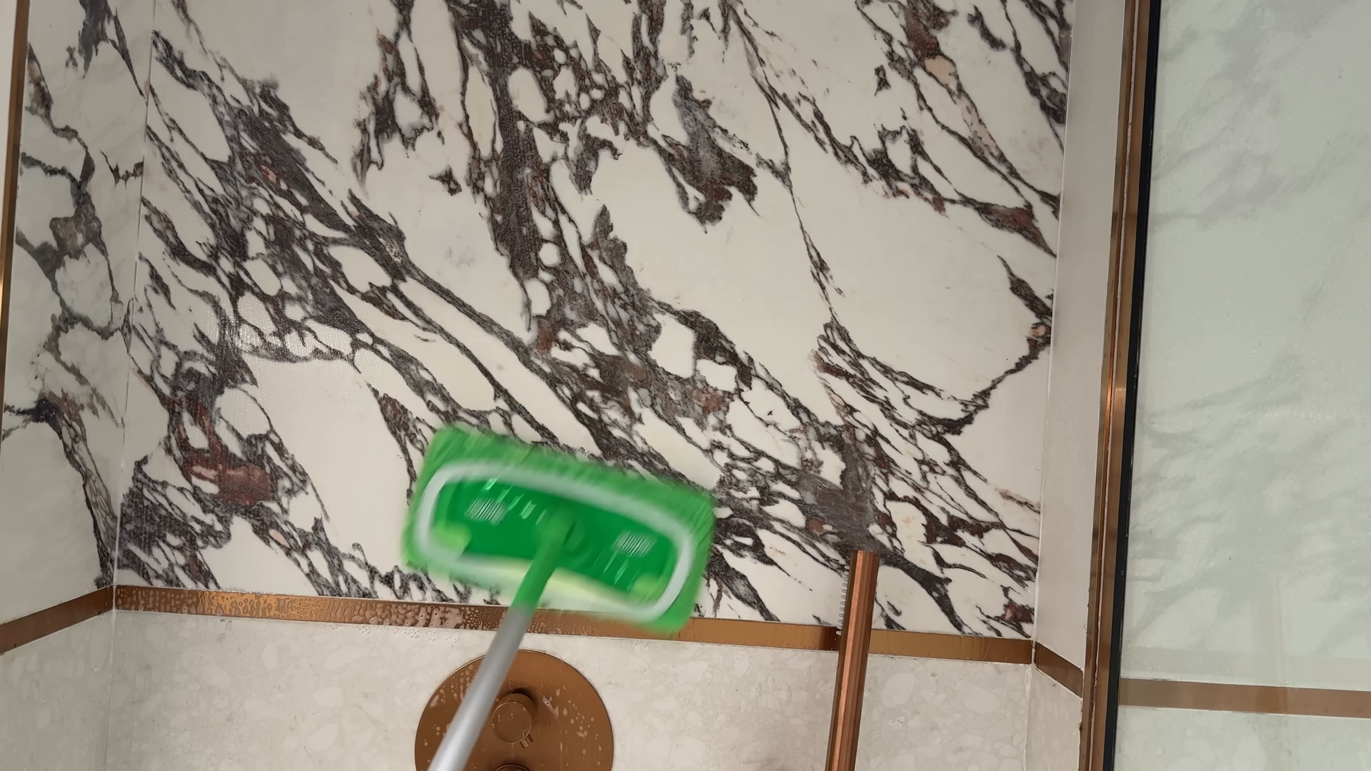 Cleaner scrubbing a kitchen range during a Park Slope Brooklyn house cleaning