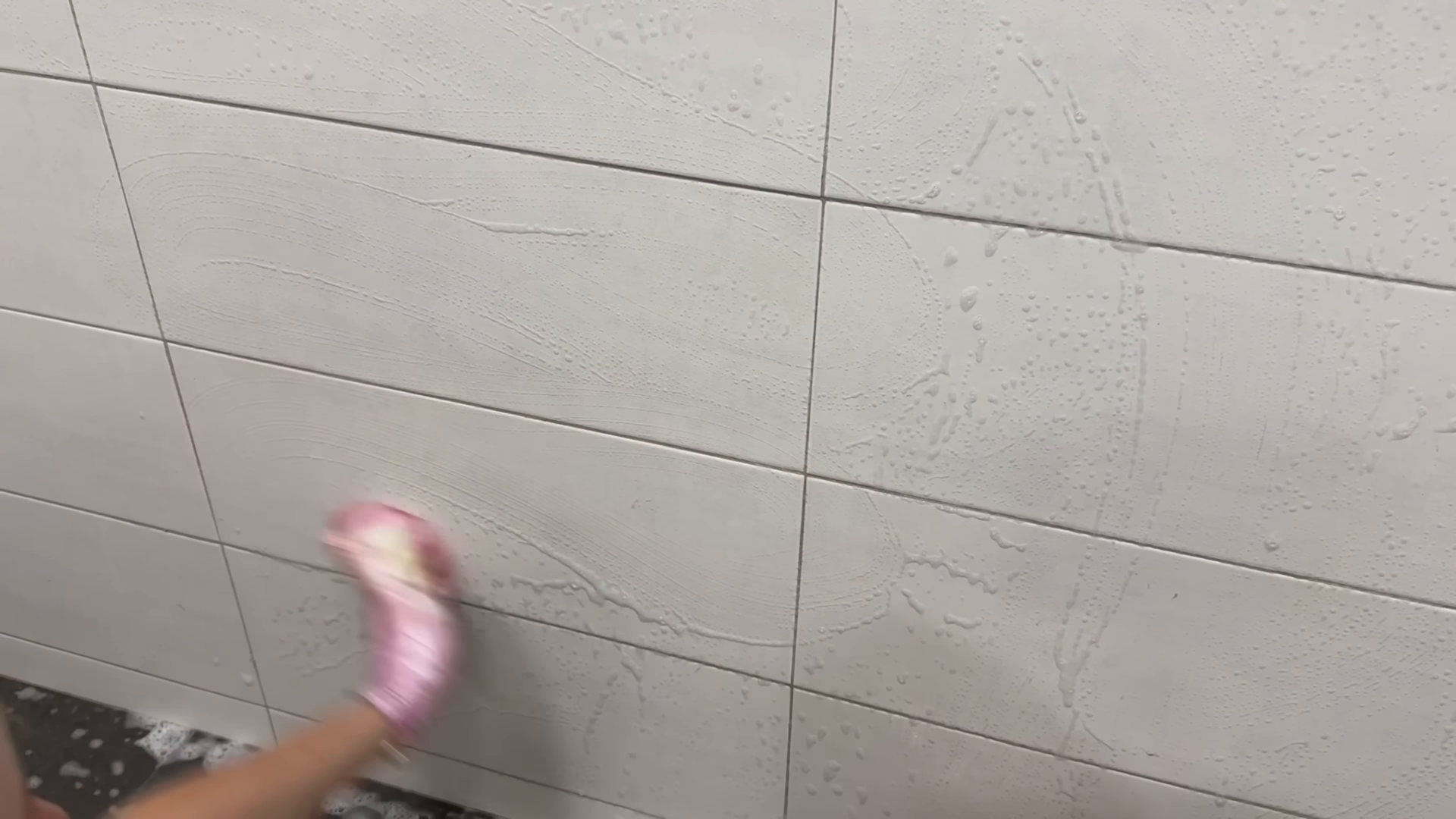 House cleaner finishing a spring cleaning in a bright Two Bridges Manhattan apartment