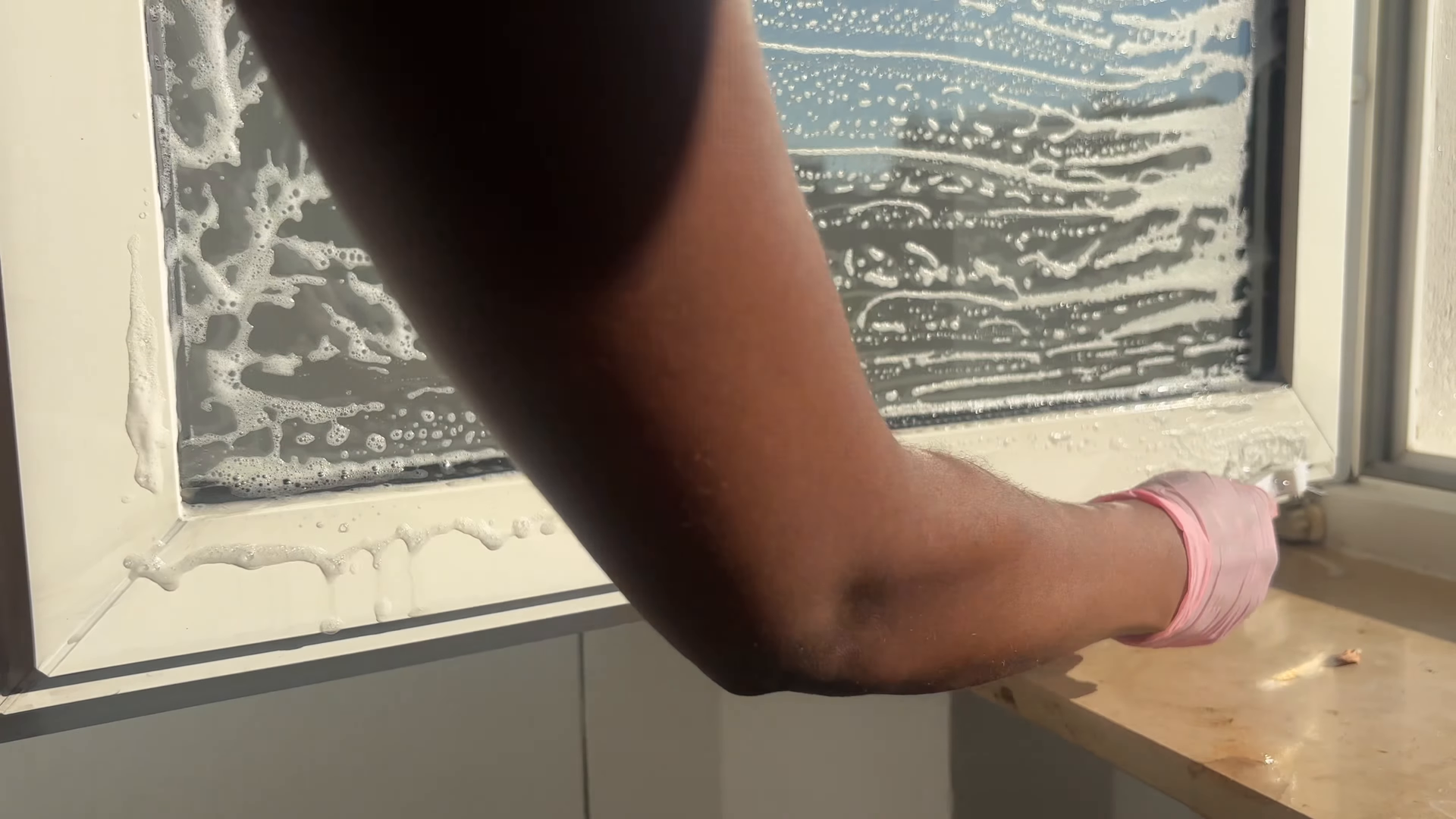 Housekeeper completing a standard basic cleaning in an Upper East Side kitchen
