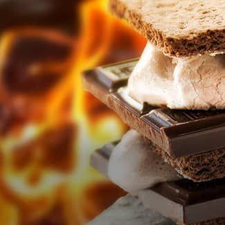 A chocolate bomb s'more with flames in background