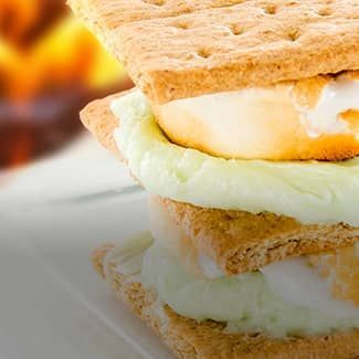 A key lime s'mores sandwich with key lime filling and marshmallows