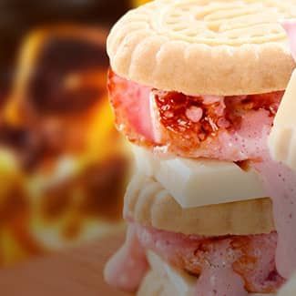 A stacked strawberry s'more with shortbread cookies, white chocolate & fresh strawberry slices.