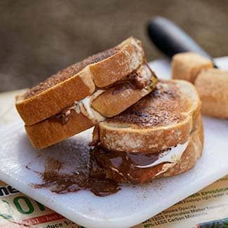 two toasted cinnamon s'moreswiches are stacked 