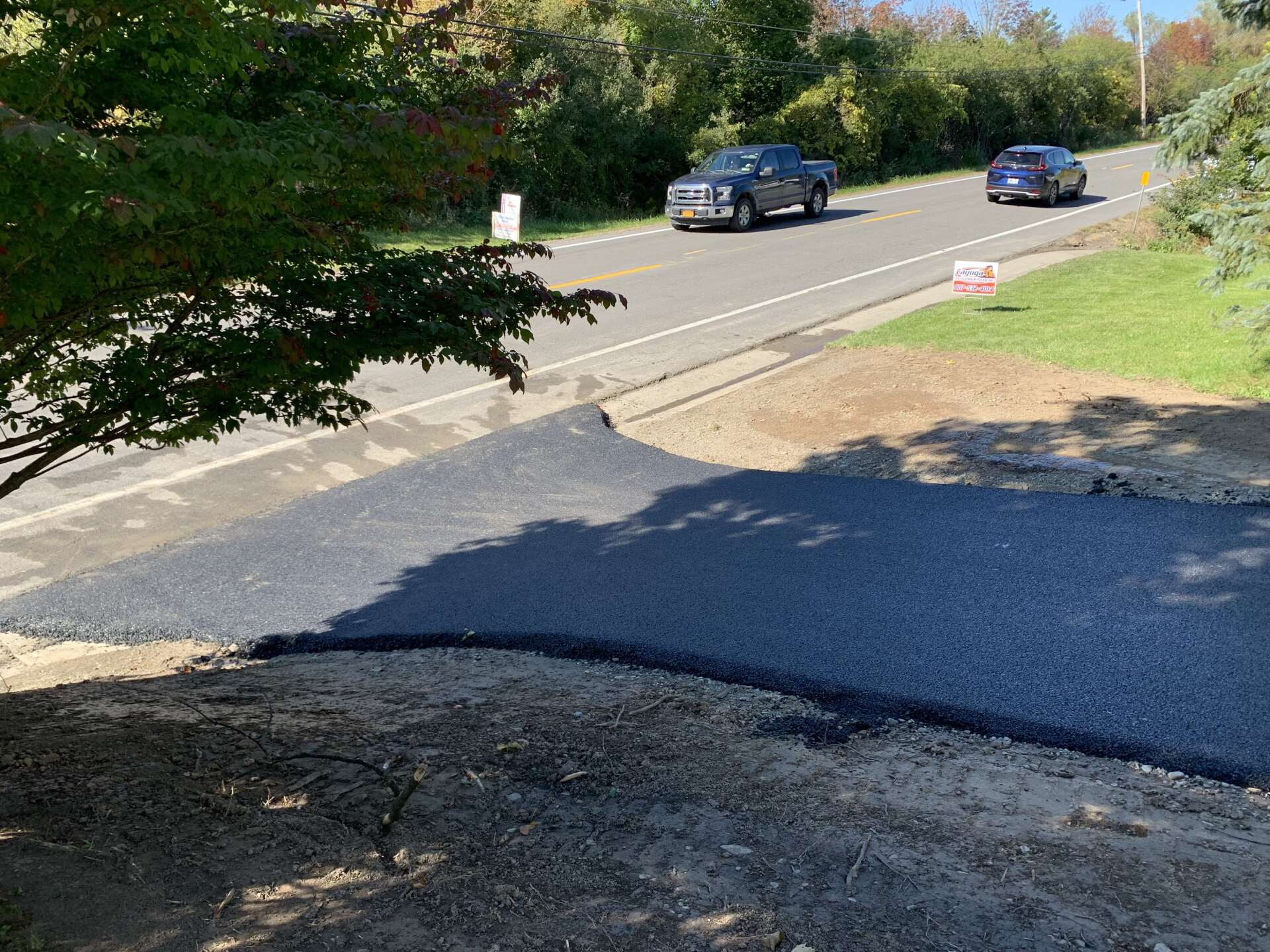 Unfinished Driveway With Cars — Finger Lakes — Cayuga Excavating & Paving