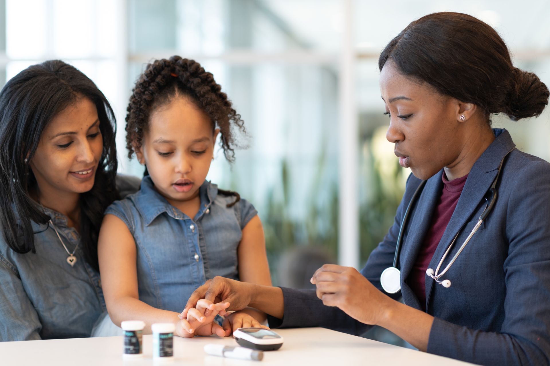 A doctor is helping a kid's hand. A doctor is helping a kid's hand.