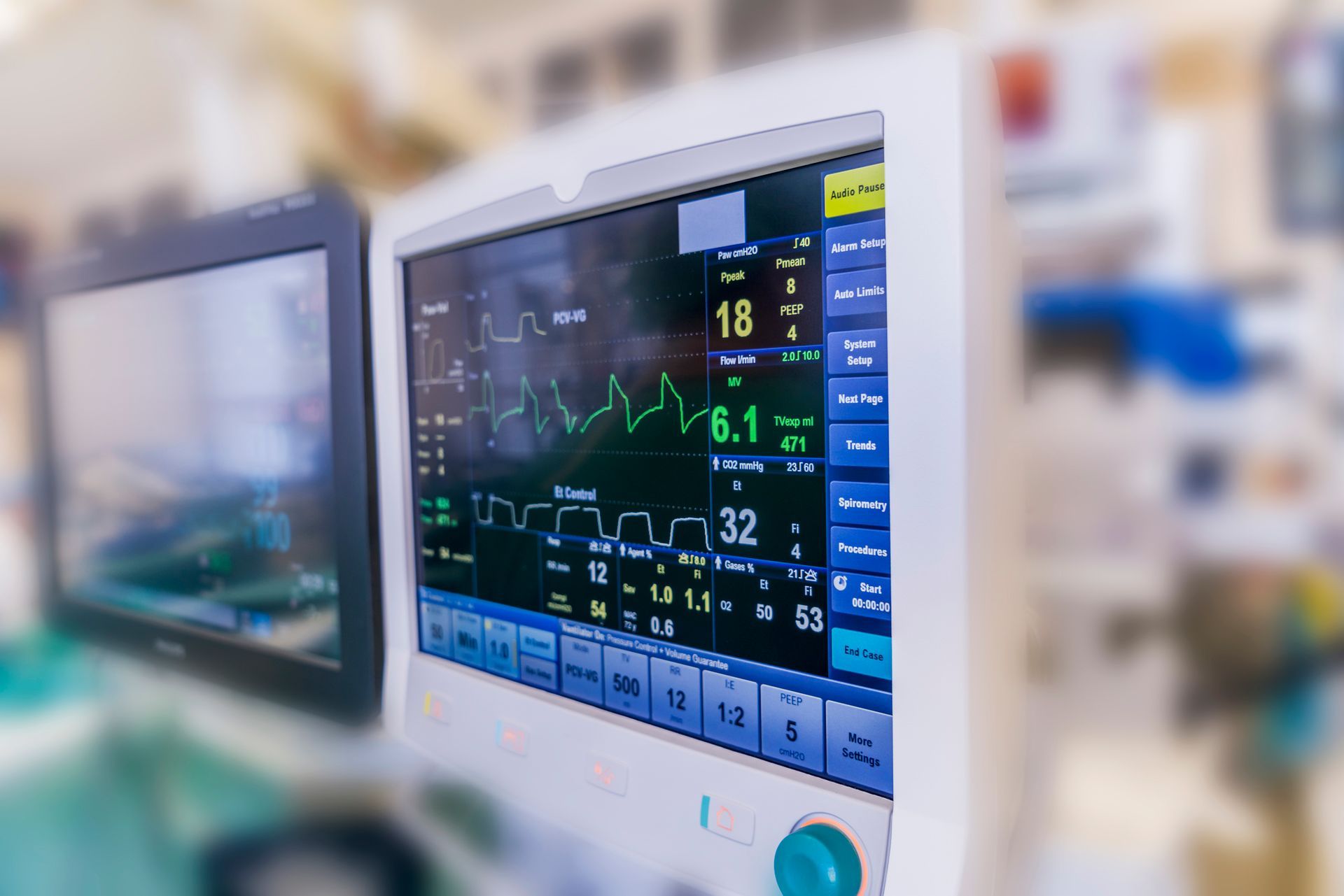 A close up of a medical monitor in an operating room. A close up of a medical monitor in an operating room.