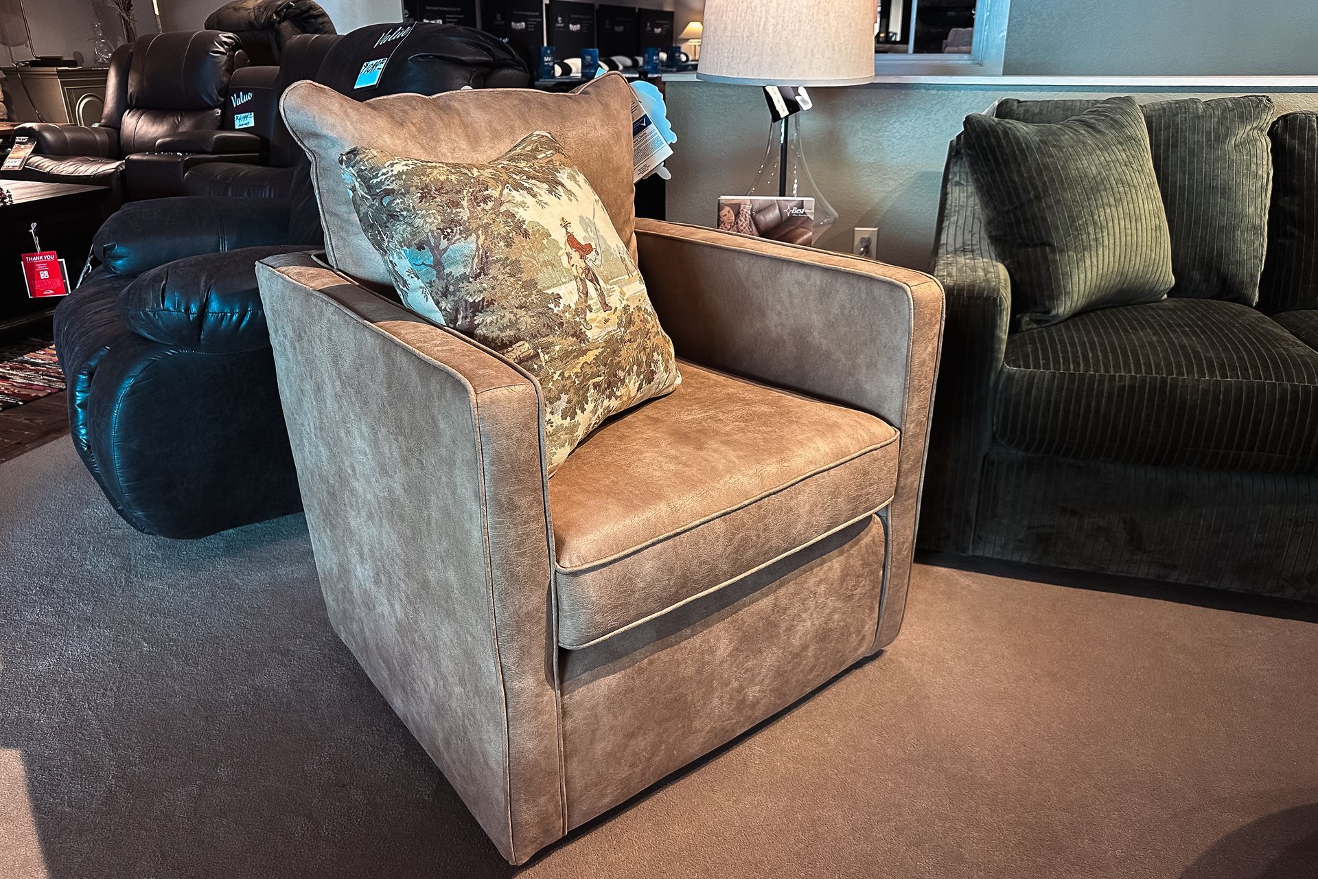 Tan upholstered accent chair with floral pillow in a living room furniture display
