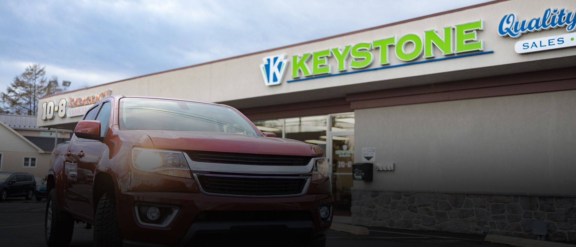 Red Chevrolet pickup truck parked outside Keystone Quality Motors | Keystone Quality Motors