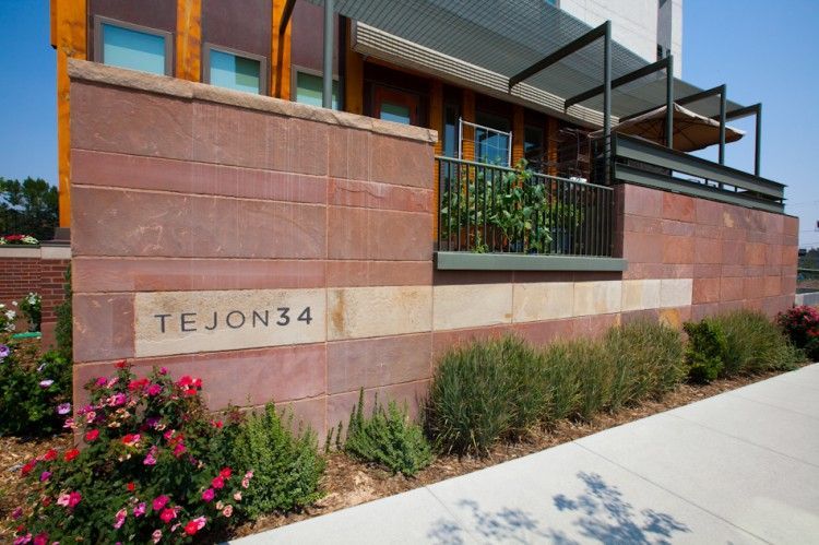 A red sandstone wall with a 