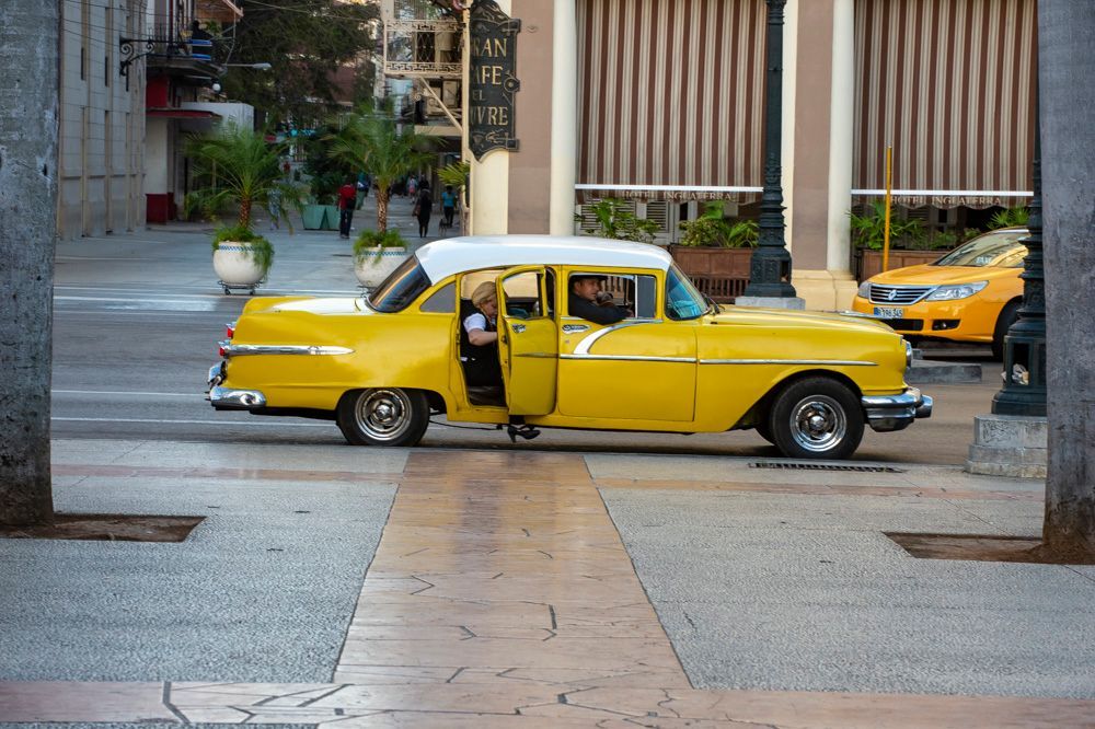 old style yellow car in Cuba