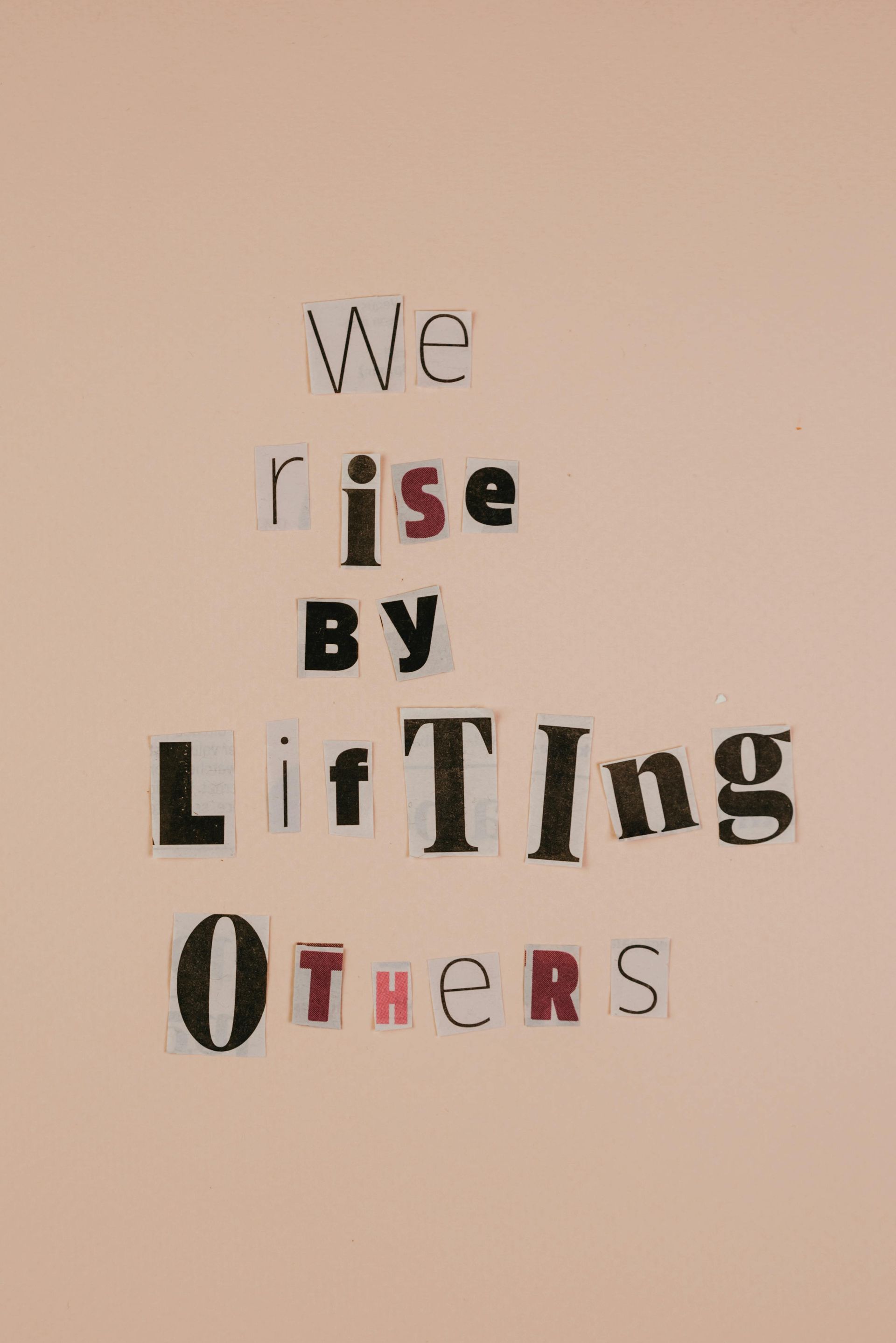 Text collage on a pink background: