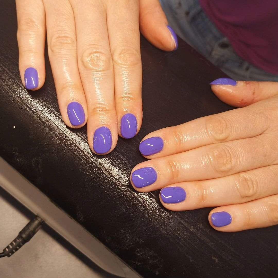 Gel polish nails in purple