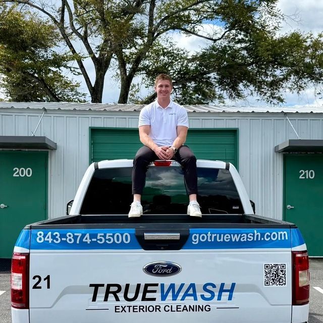 Charlie, owner of TrueWash, sitting on the TrueWash truck