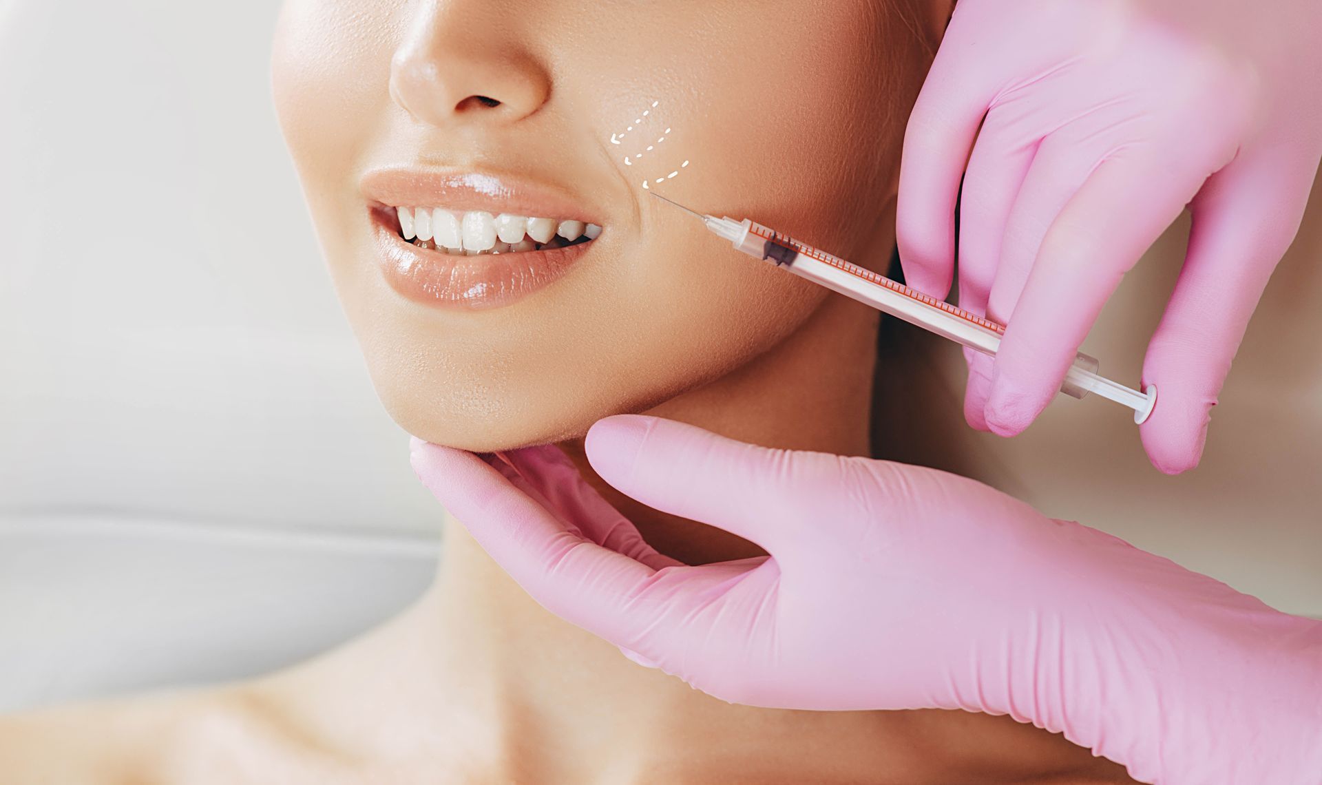 Woman’s profile illustration with a facial massage tool applied to the cheek