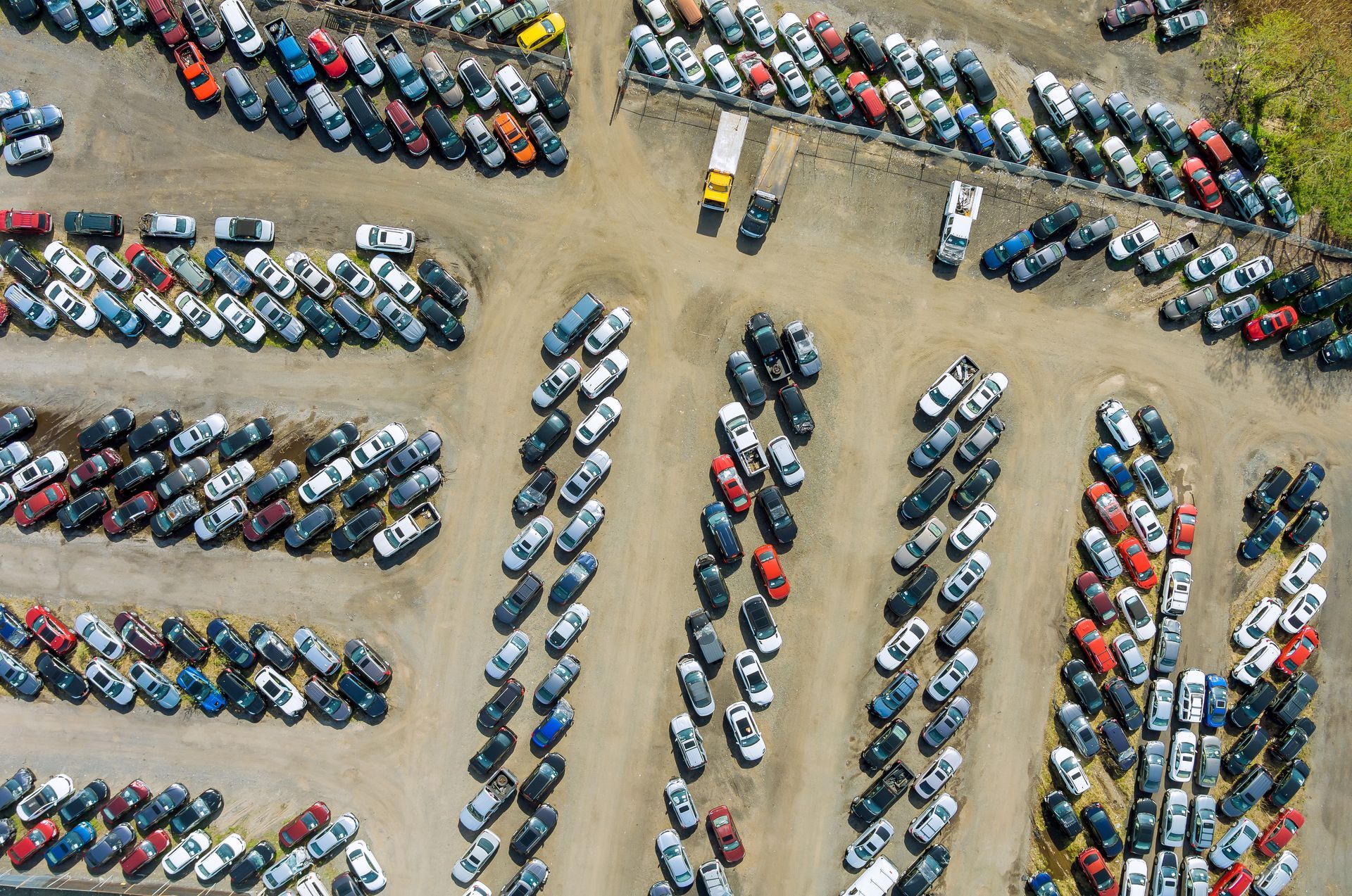 Aerial top view of used car auction for sale.