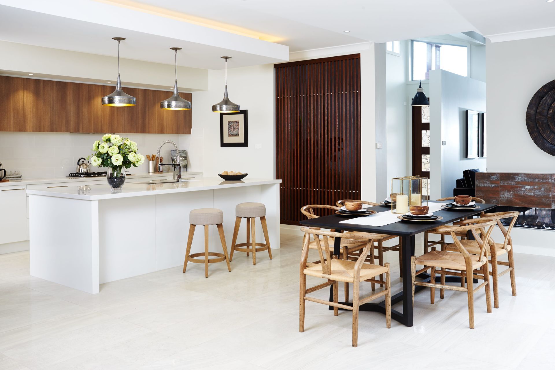 Haven 33 home design - A kitchen and dining room in a house with a table and chairs.