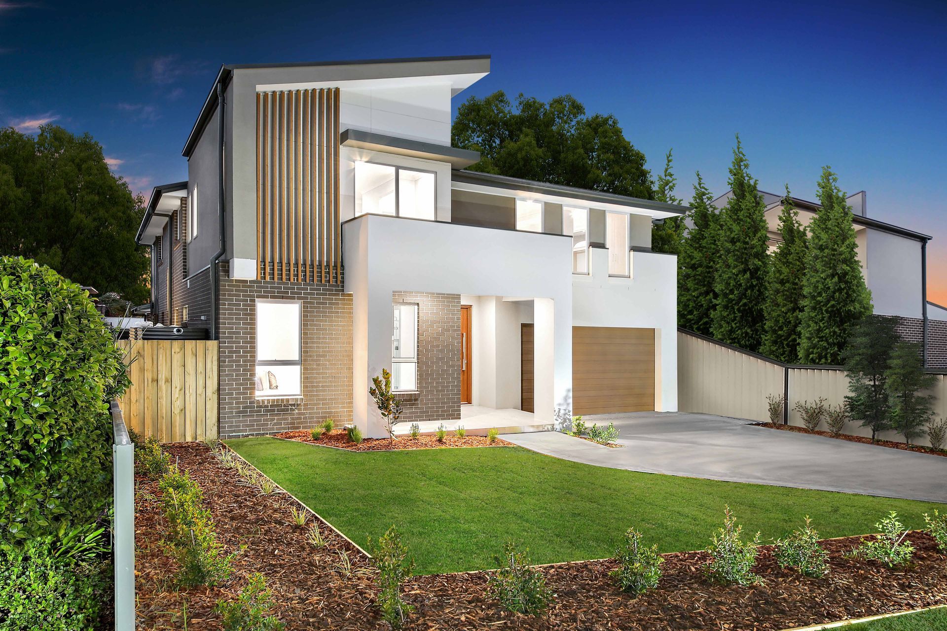 Pavillion 44 home design - A large double-story white house with a wooden fence in front of it.