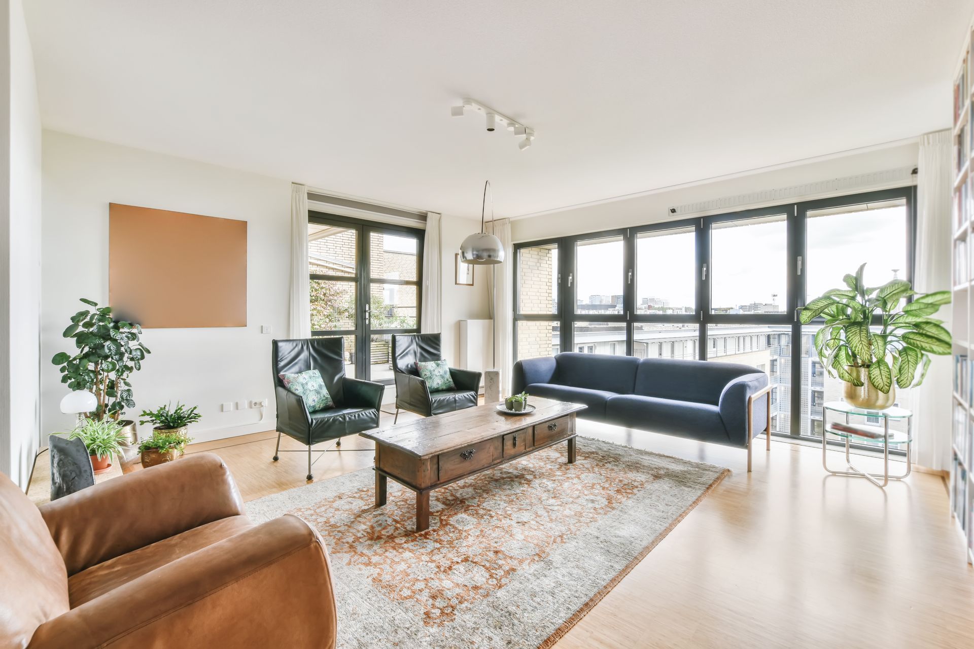 Crest 24 - A living room with a couch, chairs, and a coffee table.
