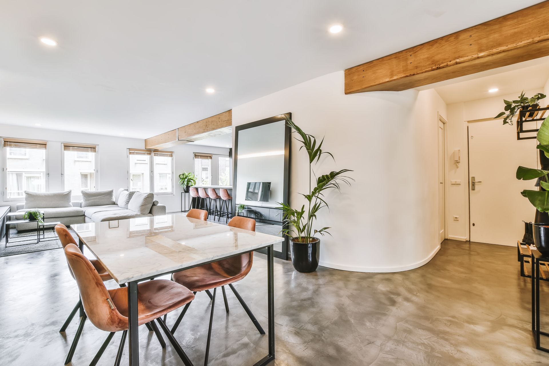 Oasis 16 - A dining table and chairs in the middle of the room.
