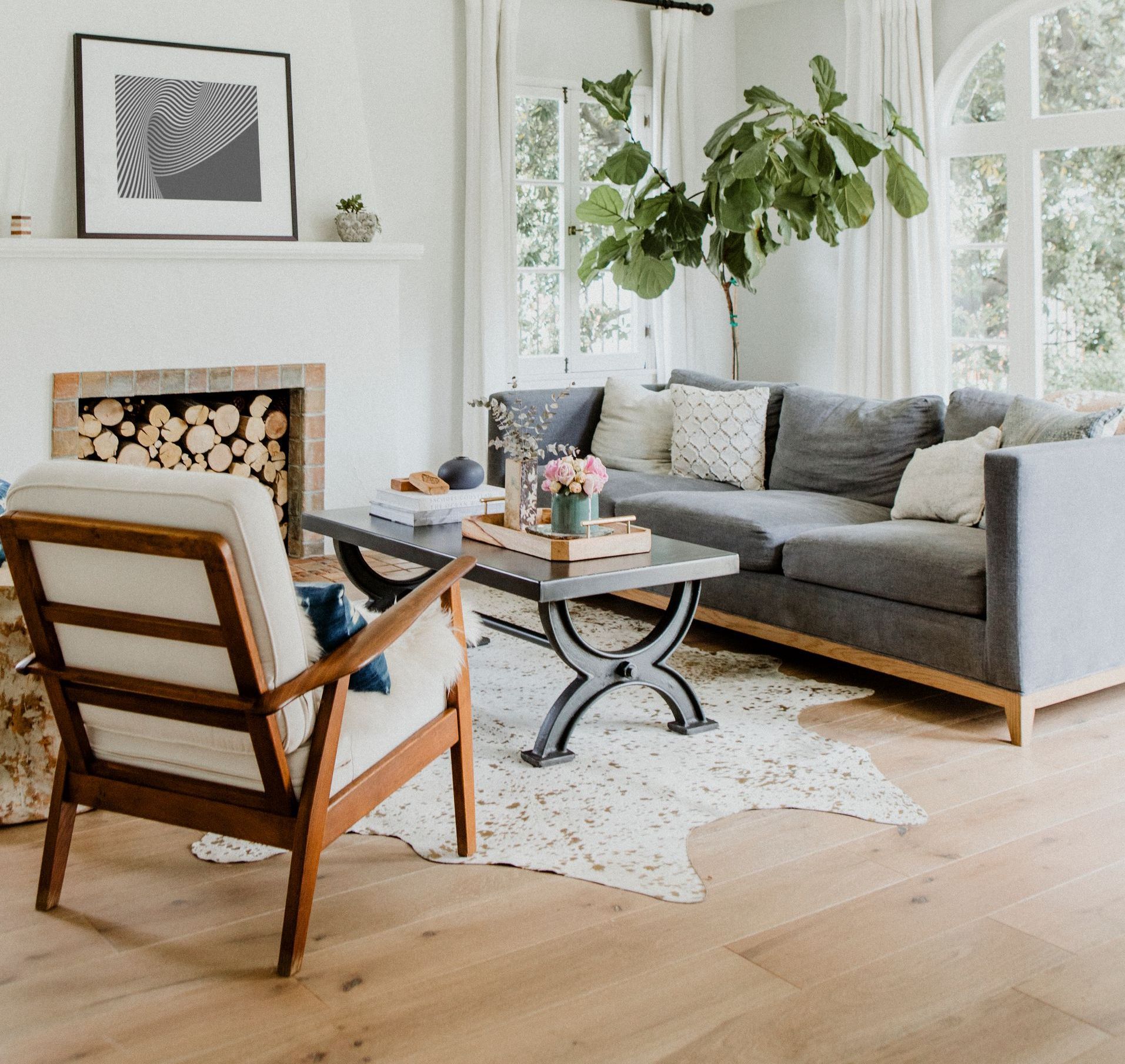 Ridge 2 - A living room with a couch, chair, coffee table and fireplace.
