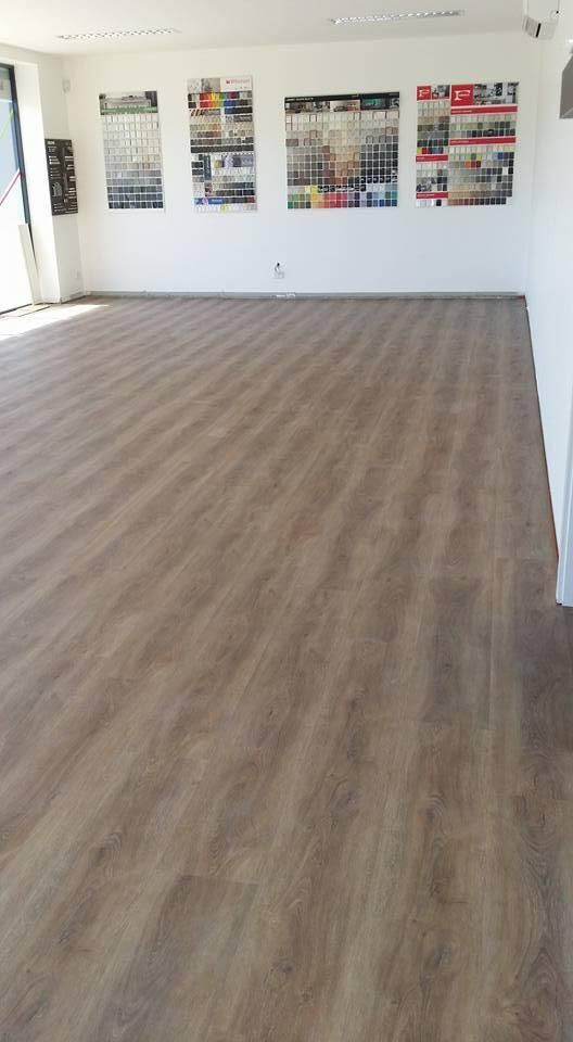 A Large Room with A Wooden Floor and White Walls — Thats Tops by Design in Armidale, NSW
