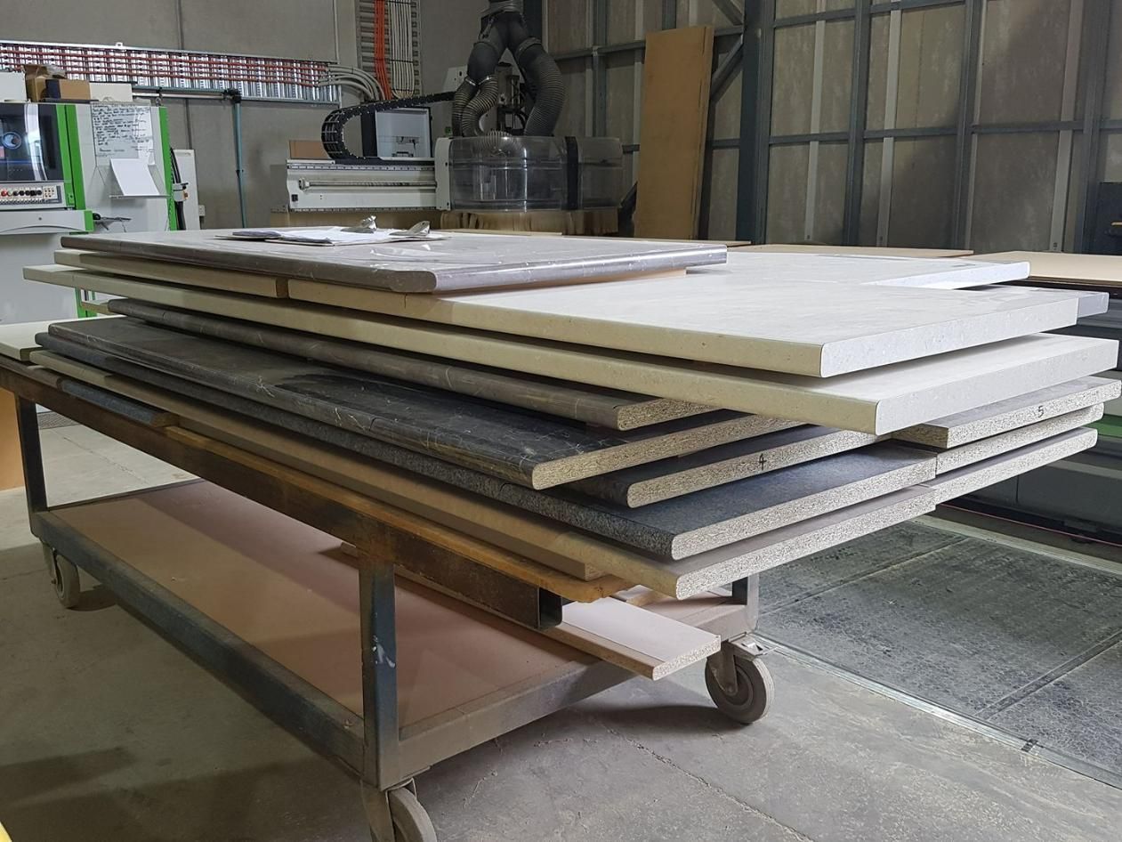 A Stack of Wooden Boards Is Sitting on Top of A Wooden Table — Thats Tops by Design in Quirindi, NSW