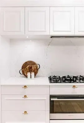 White Kitchen With Yellow Feature Lights— Thats Tops by Design in Taminda, NSW